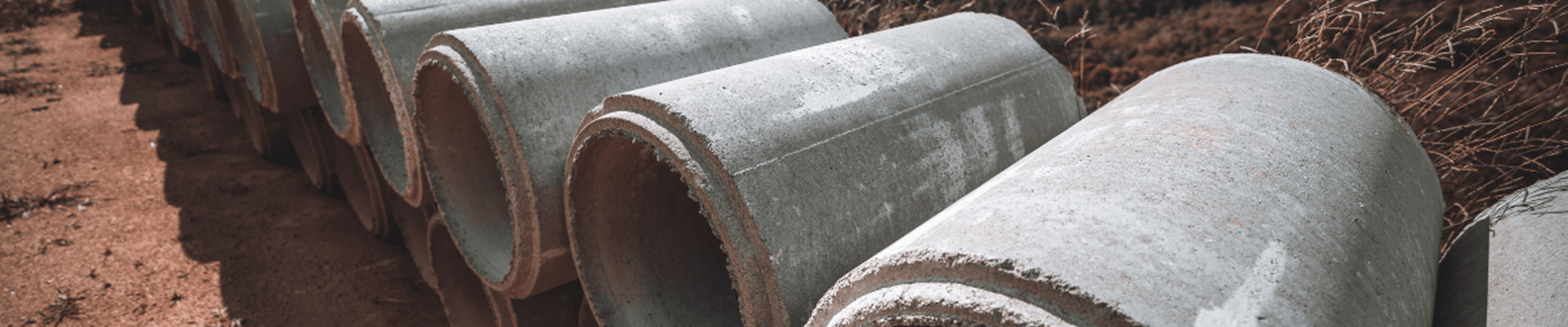 Wide-angle shot with the two rows of constructional pipes laying on top of one another