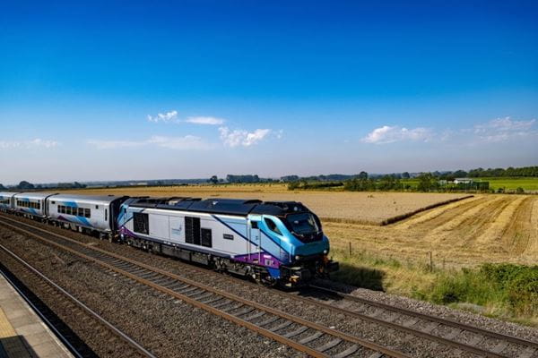 Train commuting through rural land